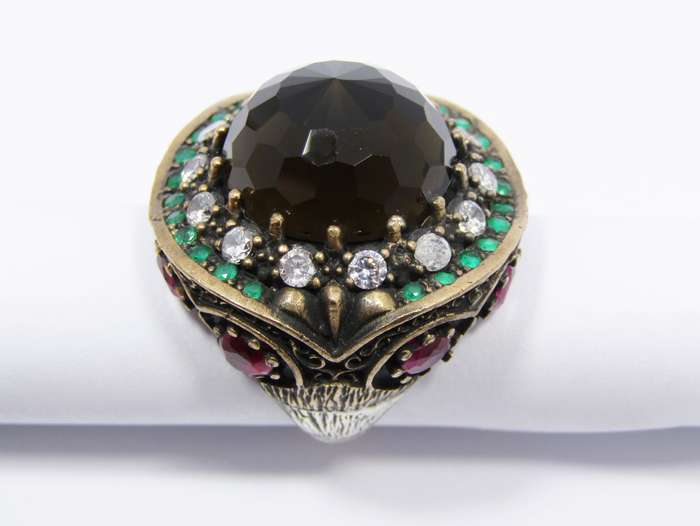 A Gorgeous Huge Facetted Smokey Color Crystal Surrounded With Pink Green and Clear Crystals in Sterl