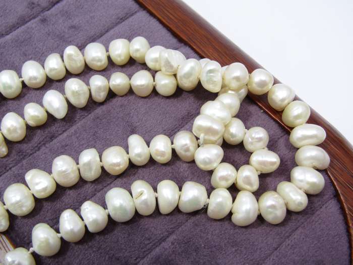 Lovely Long String of Freshwater Pearls with Silver Clasp