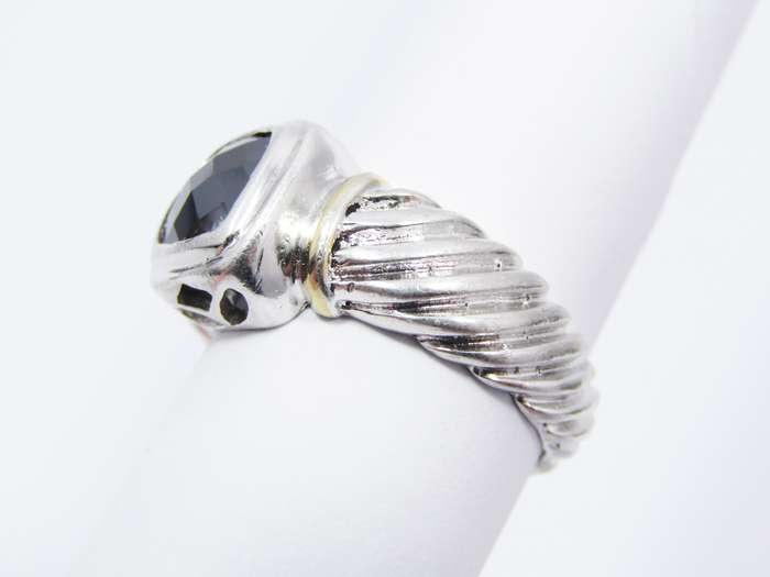A Lovely Facetted Two Tone Black Stone ring in Sterling Silver.