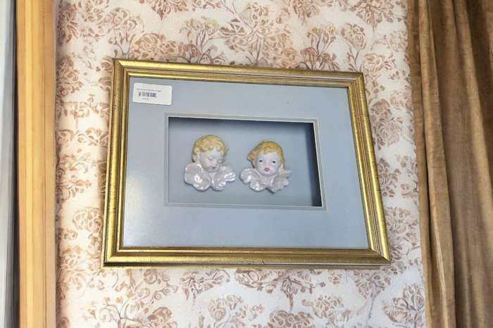 Exquisite boxed frame featuring delicate porcelain angels