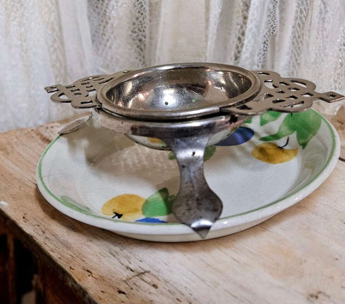 Antique strainer Aursim Ware