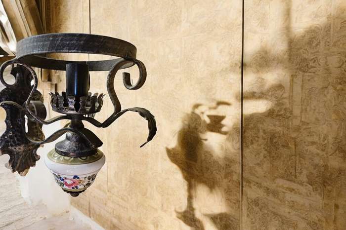 Antique Illuminate your space with a touch of rustic elegance with our wooden and metal wall scone