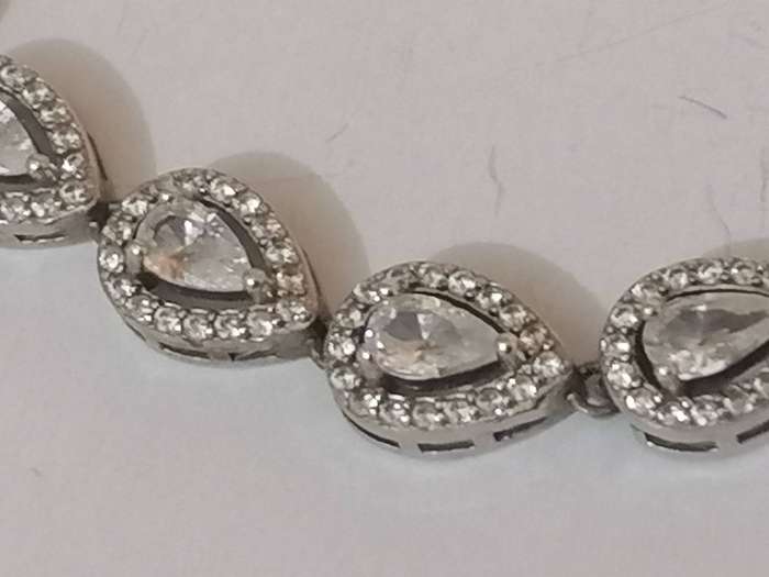 Stylish swivel locking snake chain bracelet, sterling silver with beautiful stones.