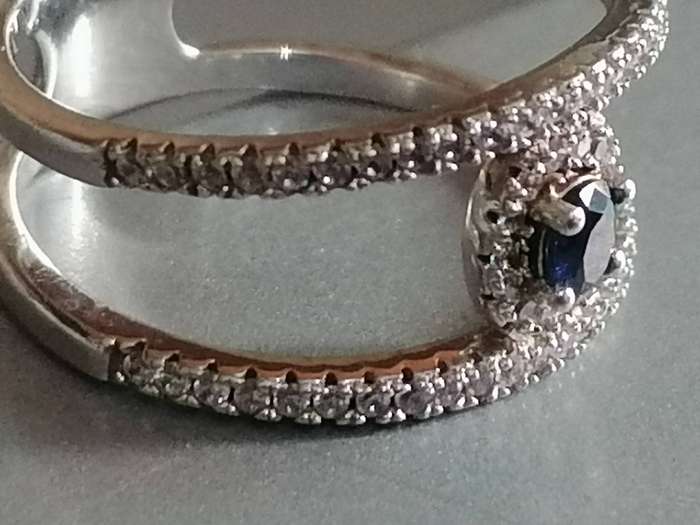 Stunning Sterling Silver 925. blue stone dress ring with CZ stones - Size P.