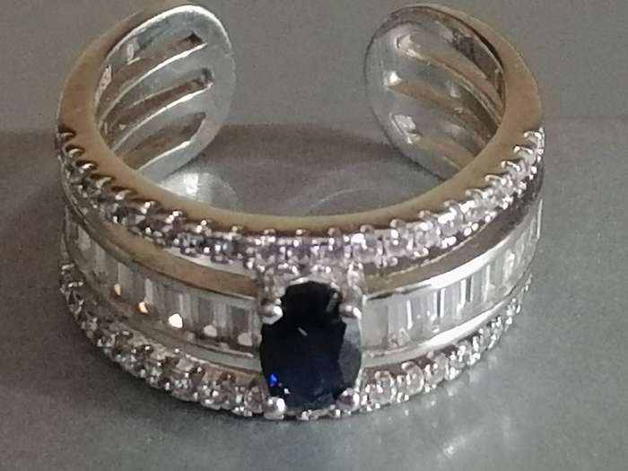 Beautiful open shank Sterling Silver 925. blue stone dress ring with CZ stones - Size M.