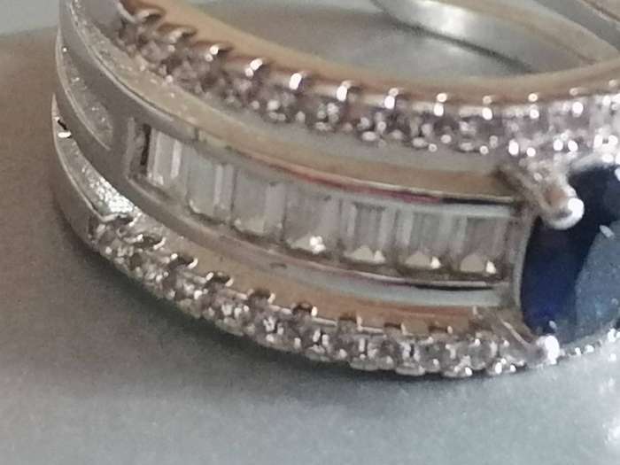 Beautiful open shank Sterling Silver 925. blue stone dress ring with CZ stones - Size M.