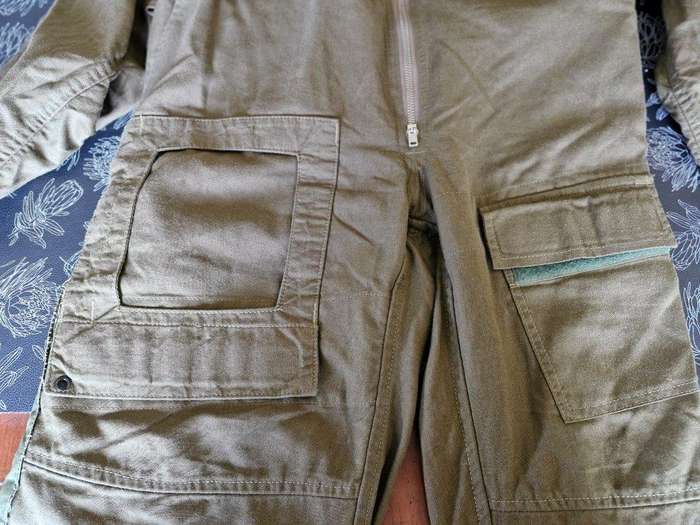 SAAF Flight Suit with survival knife. 46 Cm Armpit to Armpit. Scales one side of knife broken.