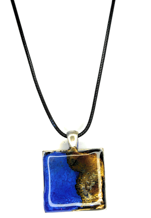 Beautiful resin pendants on a leather necklace