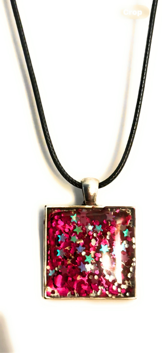 Beautiful resin pendants on a leather necklace