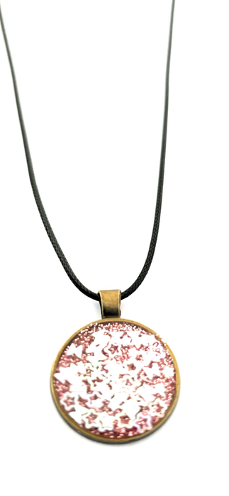 Beautiful resin pendants on a leather necklace
