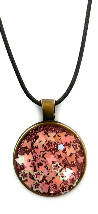 Beautiful resin pendants on a leather necklace