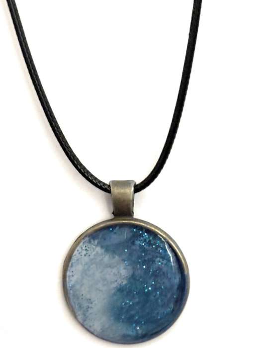 Beautiful resin pendants on a leather necklace