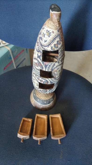 Vintage carved gourd with little trinket drawers on a Coconut shell stand. All natural