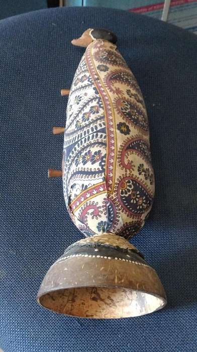 Vintage carved gourd with little trinket drawers on a Coconut shell stand. All natural