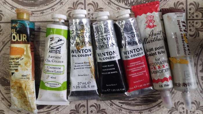 Lot of artists or crafters paints in tubes and bottles