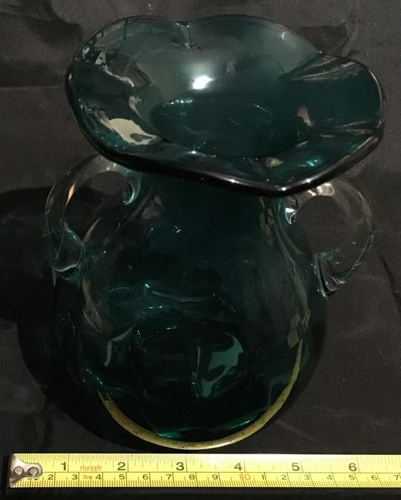 Green glass vase with ruffled edge