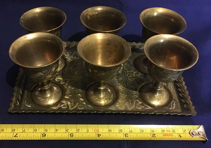 Brass egg cups (6) on a tray. Vintage