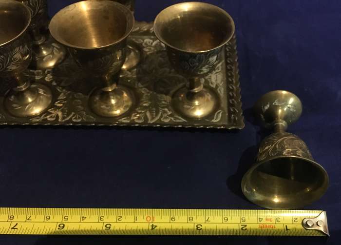 Brass egg cups (6) on a tray. Vintage
