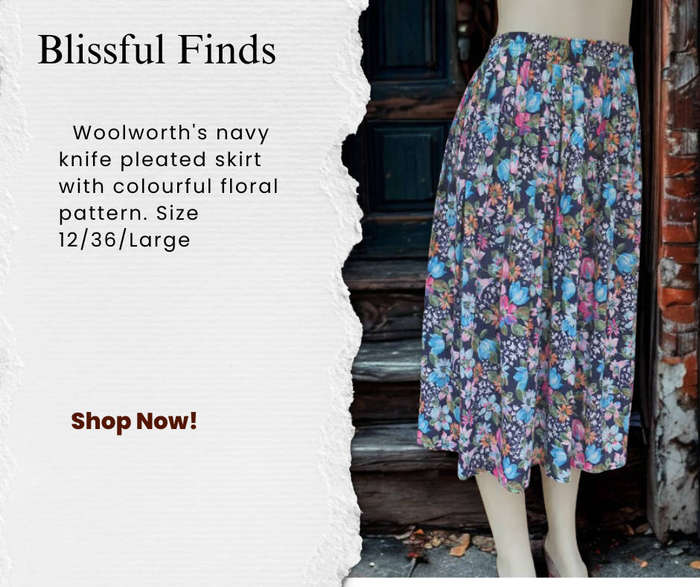 Woolworth's navy knife pleated skirt with colourful floral pattern.