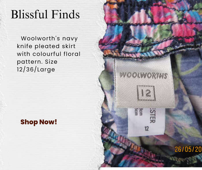 Woolworth's navy knife pleated skirt with colourful floral pattern.