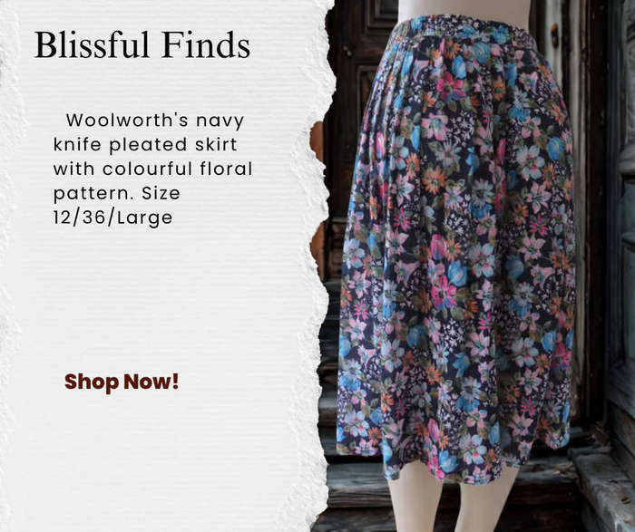 Woolworth's navy knife pleated skirt with colourful floral pattern.