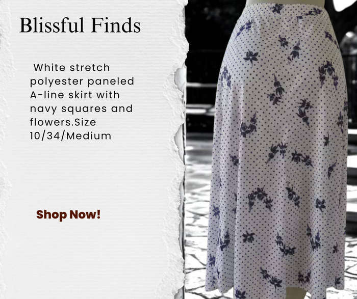 White stretch polyester paneled A-line skirt with navy squares and flowers.