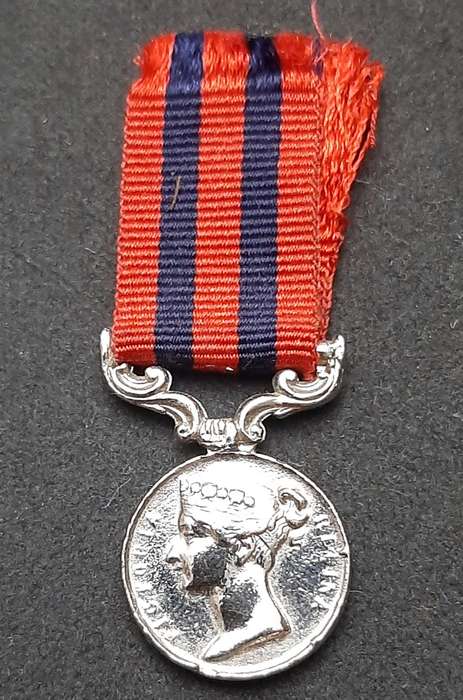 **British Army: Repro. QV 1854 India General Service Miniature Medal w/ Ribbon.**