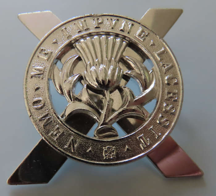 Great Britain -Scottish Lowland Brigade - Silver Coloured Staybright Cap Badge