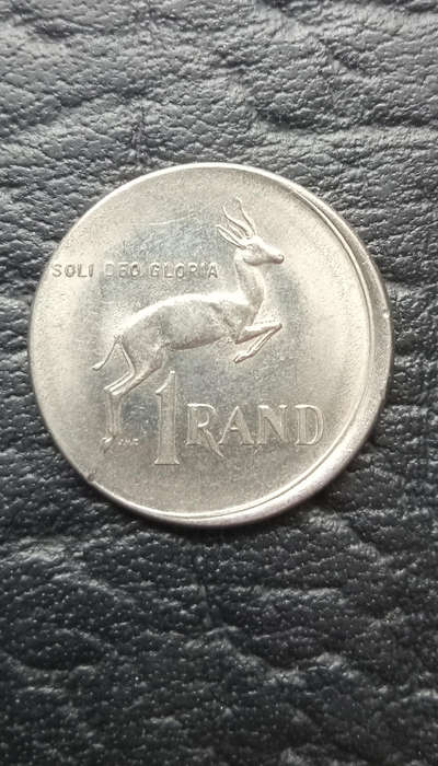 1977 R1 coin, damaged during minting