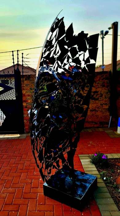Massive Metal Mask Sculpture