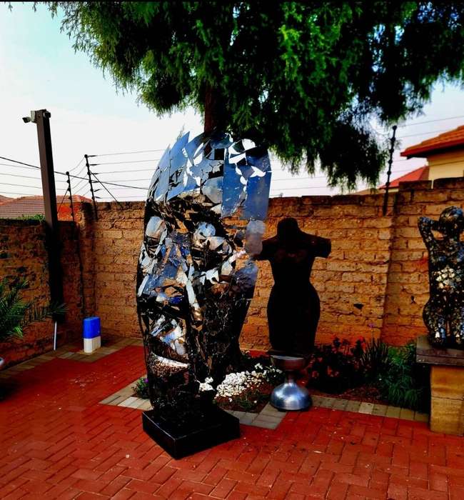 Massive Metal Mask Sculpture