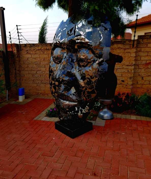 Massive Metal Mask Sculpture