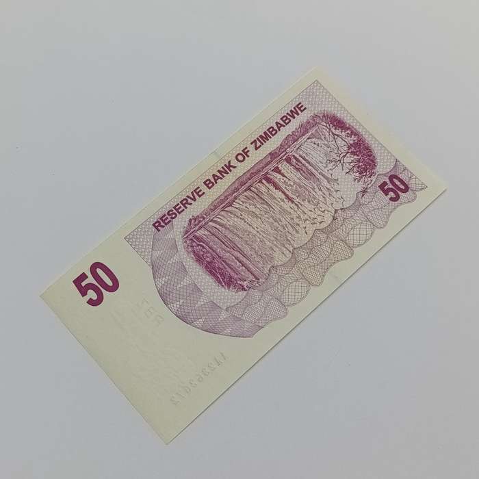 Zimbabwe $50 Bearer cheques issued 1 Aug 2006 Pair of AA numbered uncirculated notes