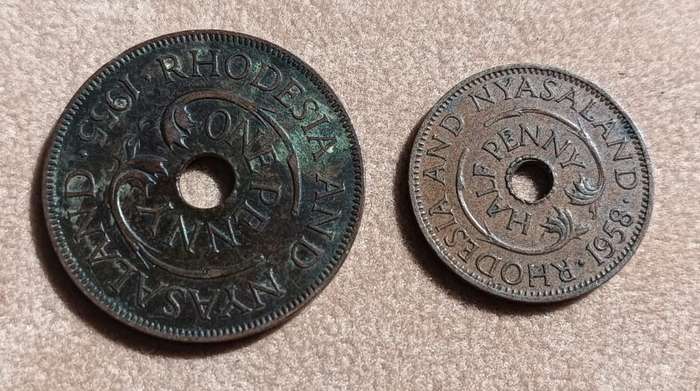 Rhodesia and Nyasaland Penny (1955) and Half Penny (1958) Bronze Coins with Distinctive Central Hole