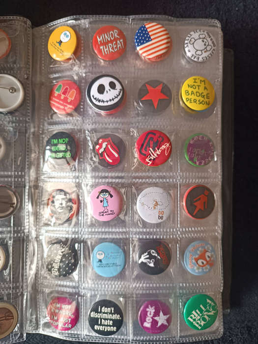 Album of 101 assorted pin badges