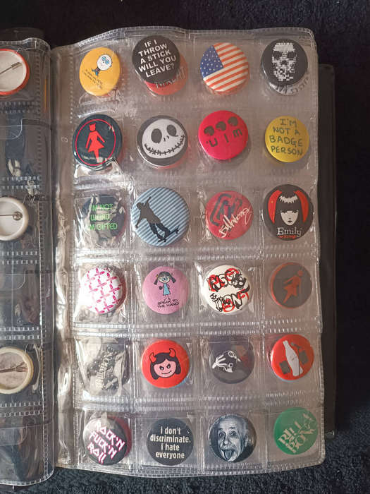 Album of 101 assorted pin badges