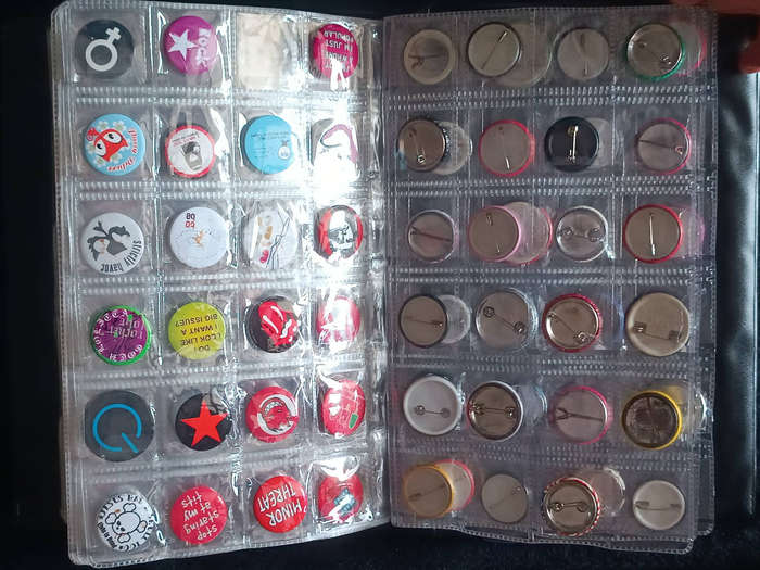 Album of 101 assorted pin badges