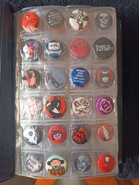 Album of 101 assorted pin badges