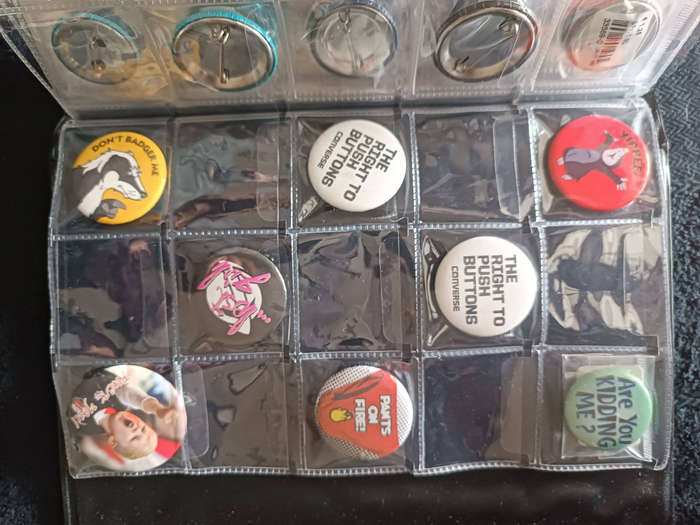Album of 101 assorted pin badges