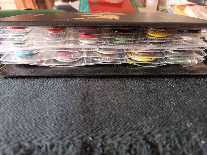 Album of 101 assorted pin badges
