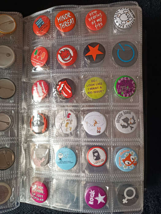 Album of 101 assorted pin badges