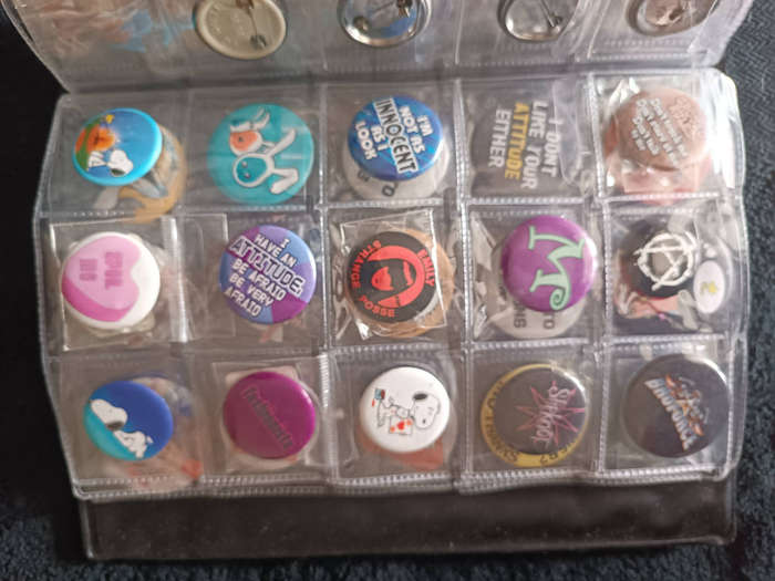 Album of 101 assorted pin badges