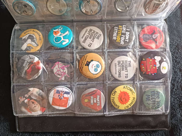 Album of 101 assorted pin badges