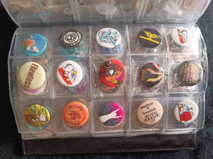 Album of 101 assorted pin badges