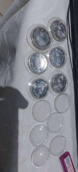 vintage Coins in capsule unsure of material