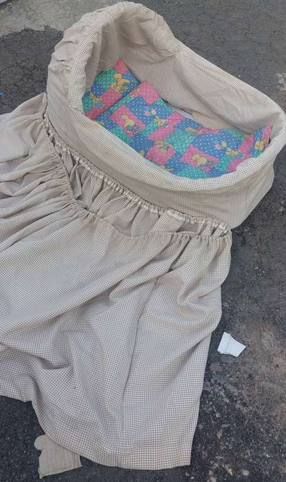 Rocking baby Moses/ wicker bassinet basket with a  fabric skirt.