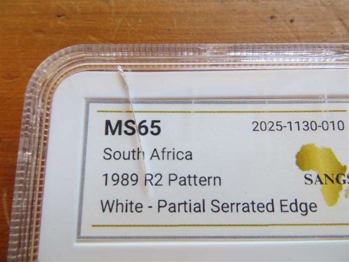 1989 R2 Pattern Coin MS65 SANGS Graded Partial Serrated Edge-Cracked Slab