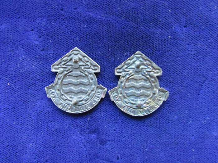 Pair of Army Logistic Ordinance Collar Badges. Pins intact.