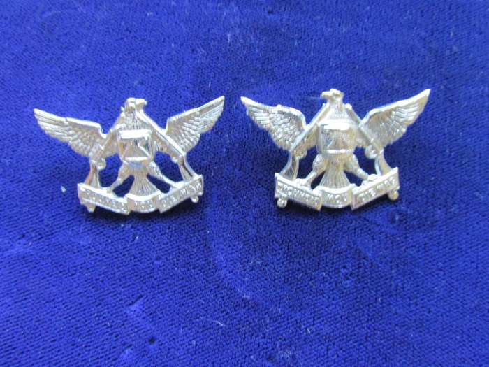 Pair of Regiment De Wet Collar Badges. Pins intact.
