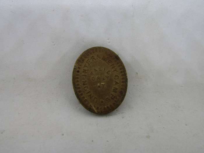Rare Interment Camp Sixpence Token. Most destroyed.